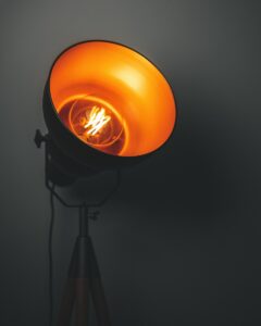turned-on lamp with tripod