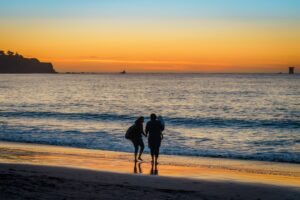 A family in Baker Beach at Sunset