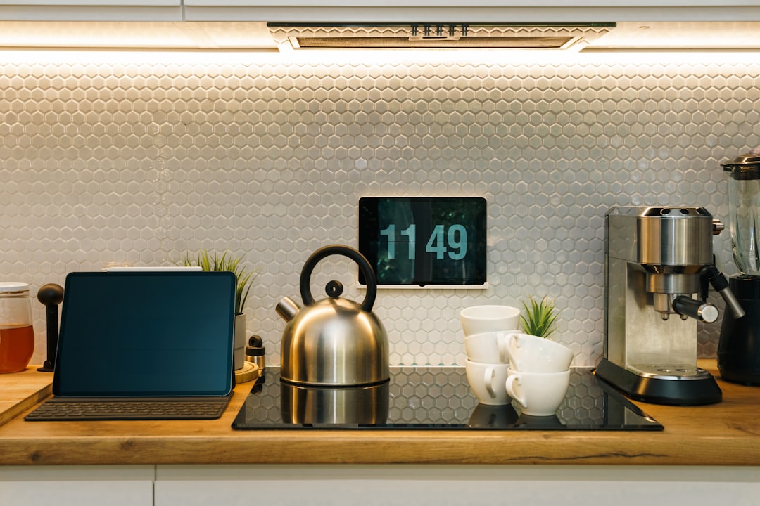 Kitchen Interior Coffee Maker Laptop and Digital Clock Display